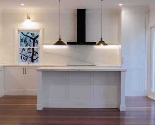 Artarmon open plan kitchen renovation with island bench, pendant lighting, and custom cabinetry by Magico Constructions