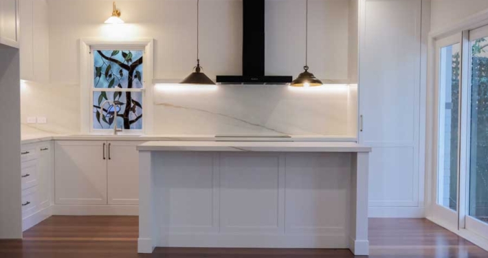 Artarmon open plan kitchen renovation with island bench, pendant lighting, and custom cabinetry by Magico Constructions